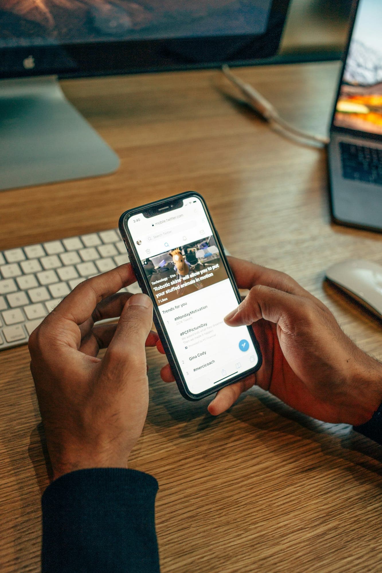 A person holding a phone over a table